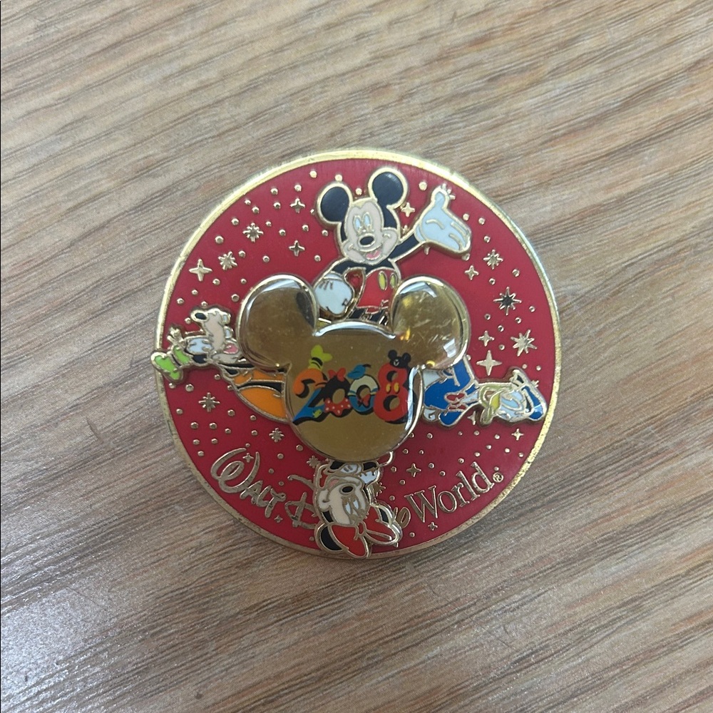 Disney 2008 Gold and Red Spinning Pin
